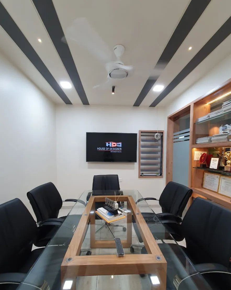 Meeting room with glass table and display screen