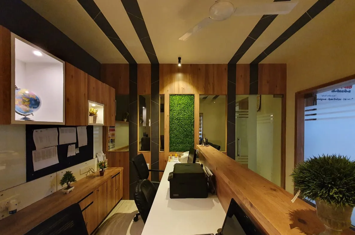 Main work area with wooden counter and green wall